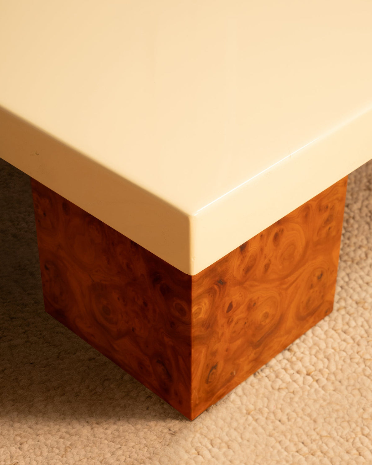 Corner detail of 1970s wooden side table with cream lacquered top