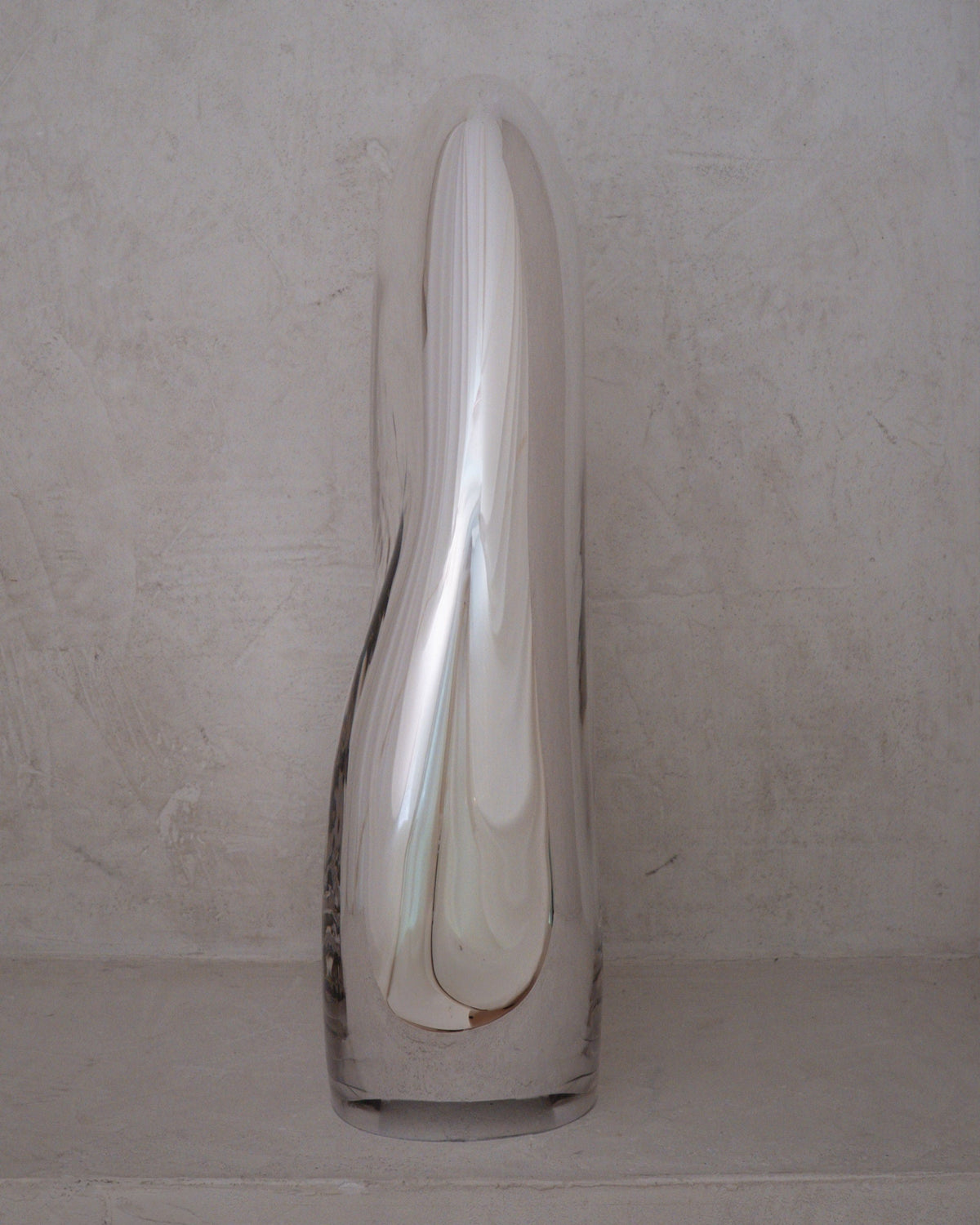 Standing Glass Sculpture - Contemporary Mirror Collection — front view on textured stone surface
