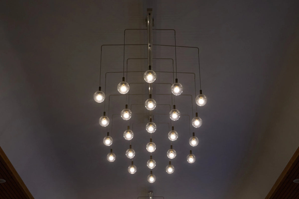 Monumental Pair of Mid-Century Chandeliers in Glass, Metal and Patinated Brass 1960, 1960 — lifestyle setting