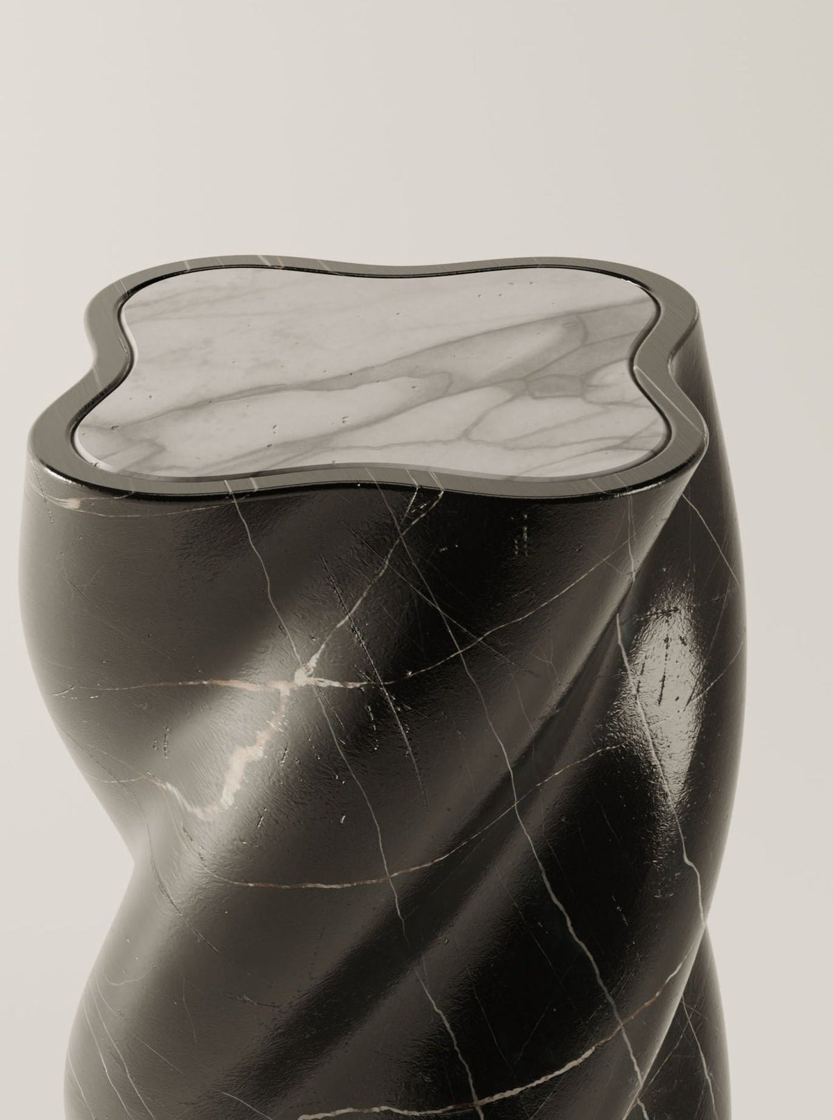 The BURGIO fUUUUsillo Nero Marquina pedestal features a twisted, curving form in black marble with a smooth, irregular arabescato marble top, displayed against a plain light background.