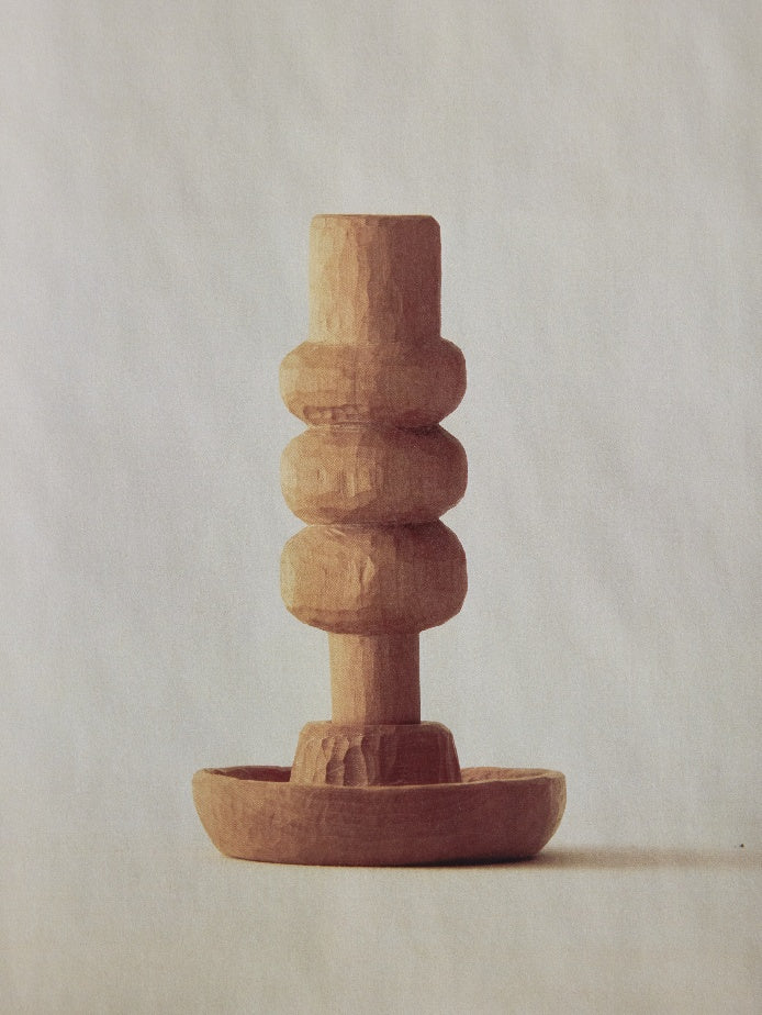 Hand-carved wood sculpture with stacked forms by Karim Charlebois