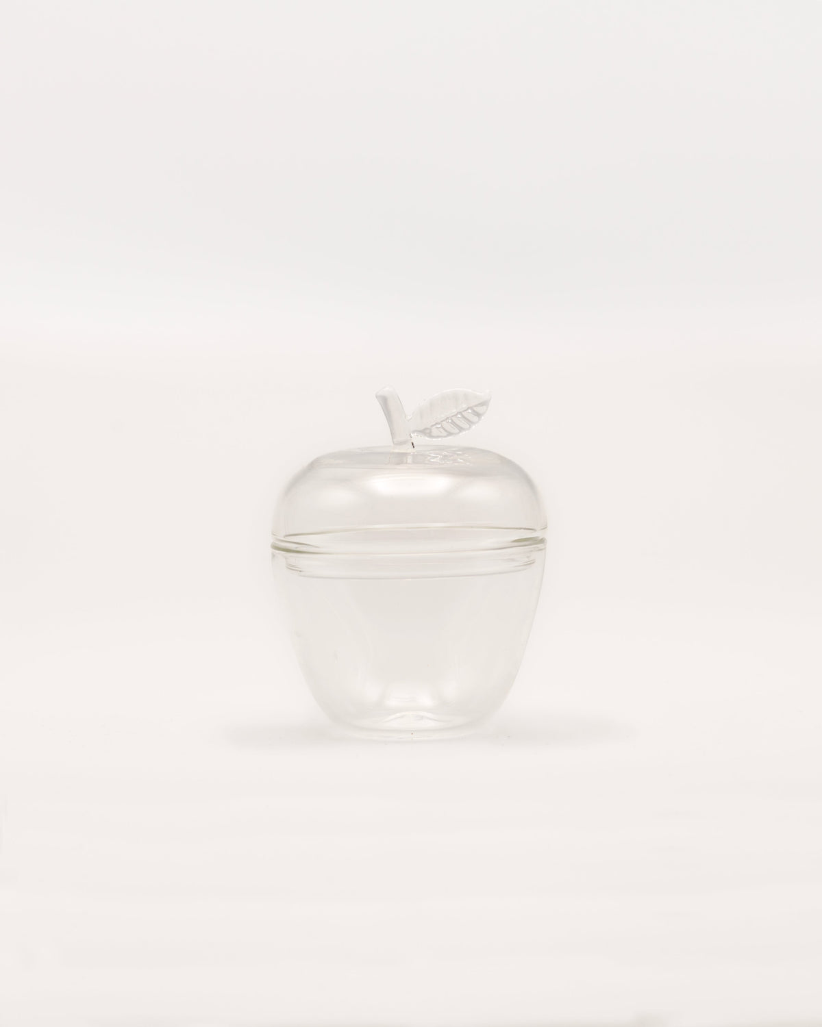 La Pomme — clear glass apple container with leaf detail