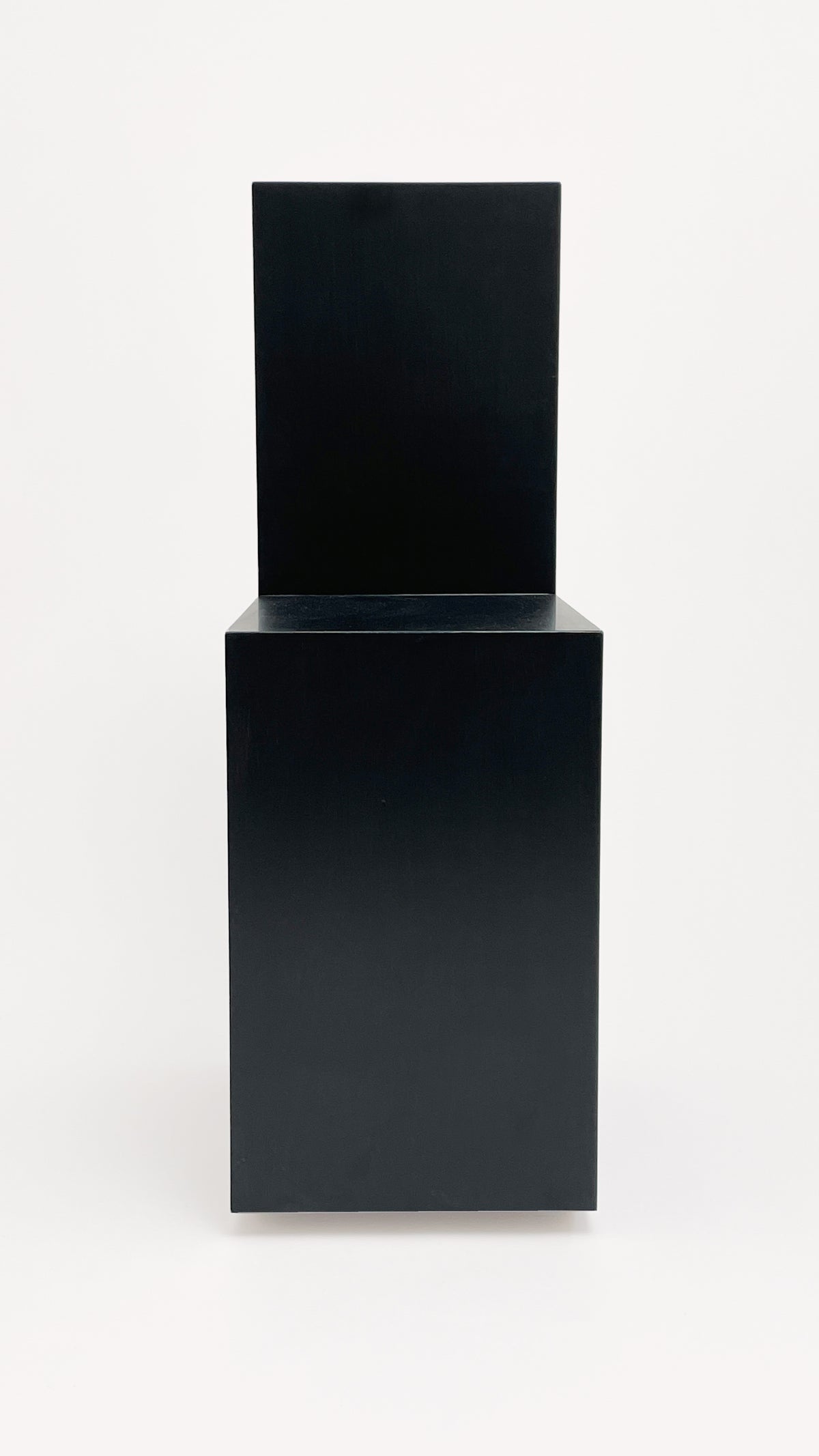 The Art Rocker Chair by GOONS, a black minimalist geometric chair featuring a rectangular seat and backrest, showcases customizable contemporary furniture design against a plain white background.