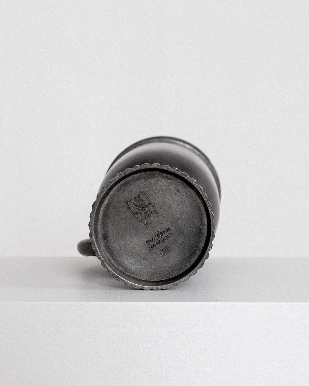 Bottom view of elegant Swedish pewter vase showing maker's mark