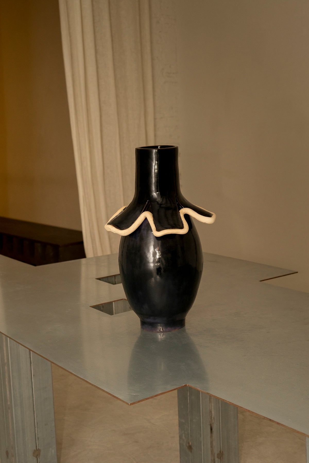 Navy ceramic vase with cream ruffled collar detail, Los Objetos Decorativos