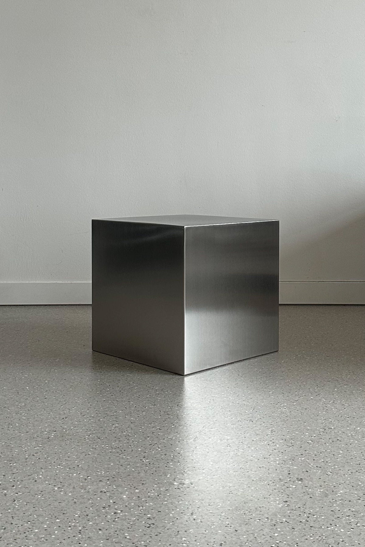 'NOSTALGIA' stainless steel cube — in context