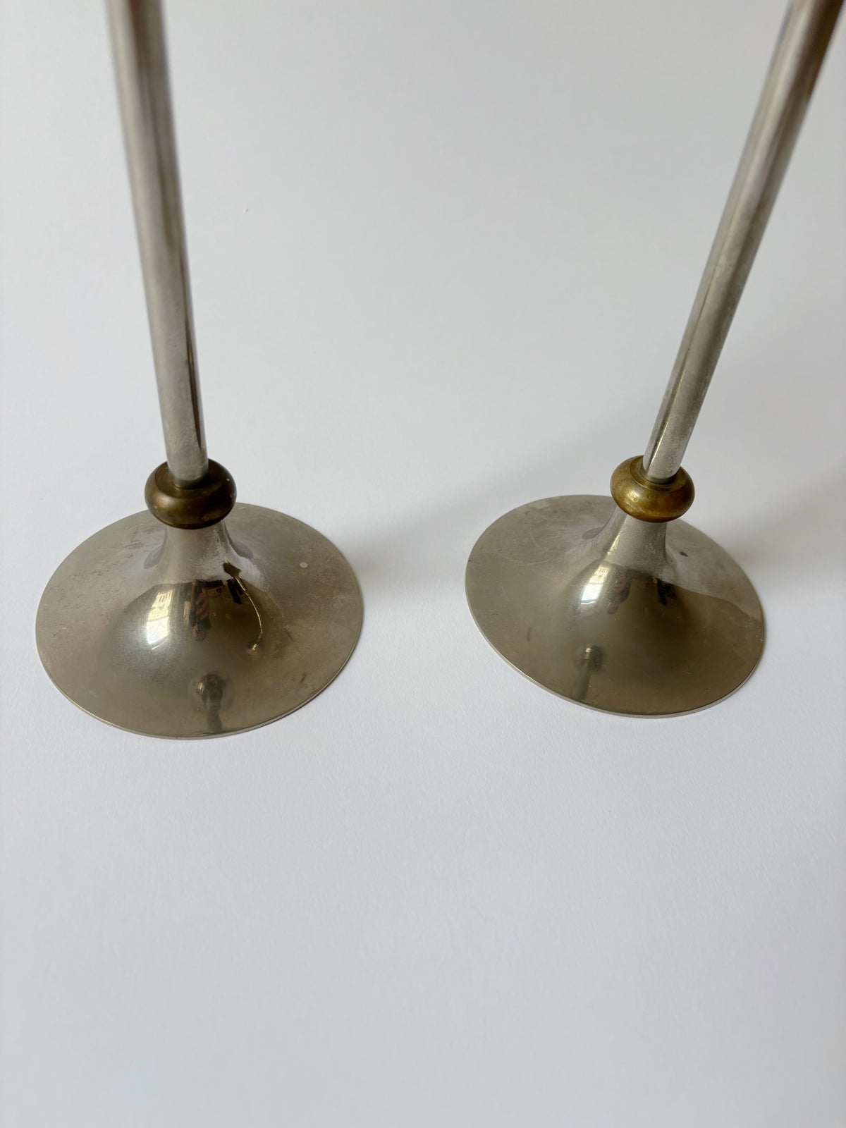 2 Metal Postmodern Candleholders — angled view on white background