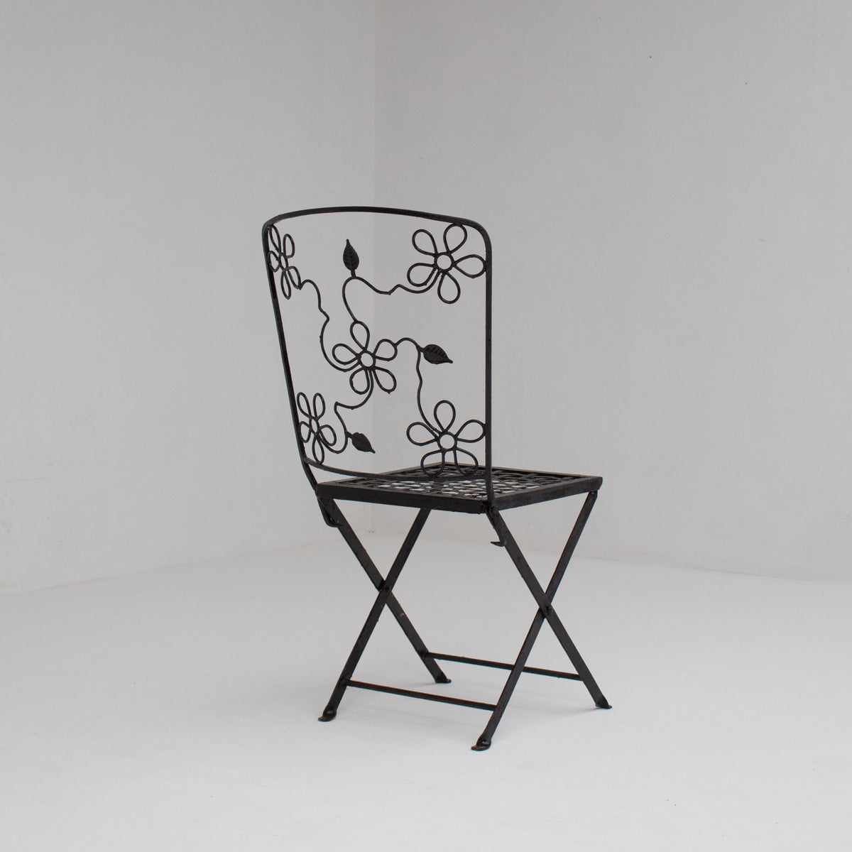 Set of Three Decorative Wrought Iron Garden Chairs with Floral Backrests — lifestyle setting