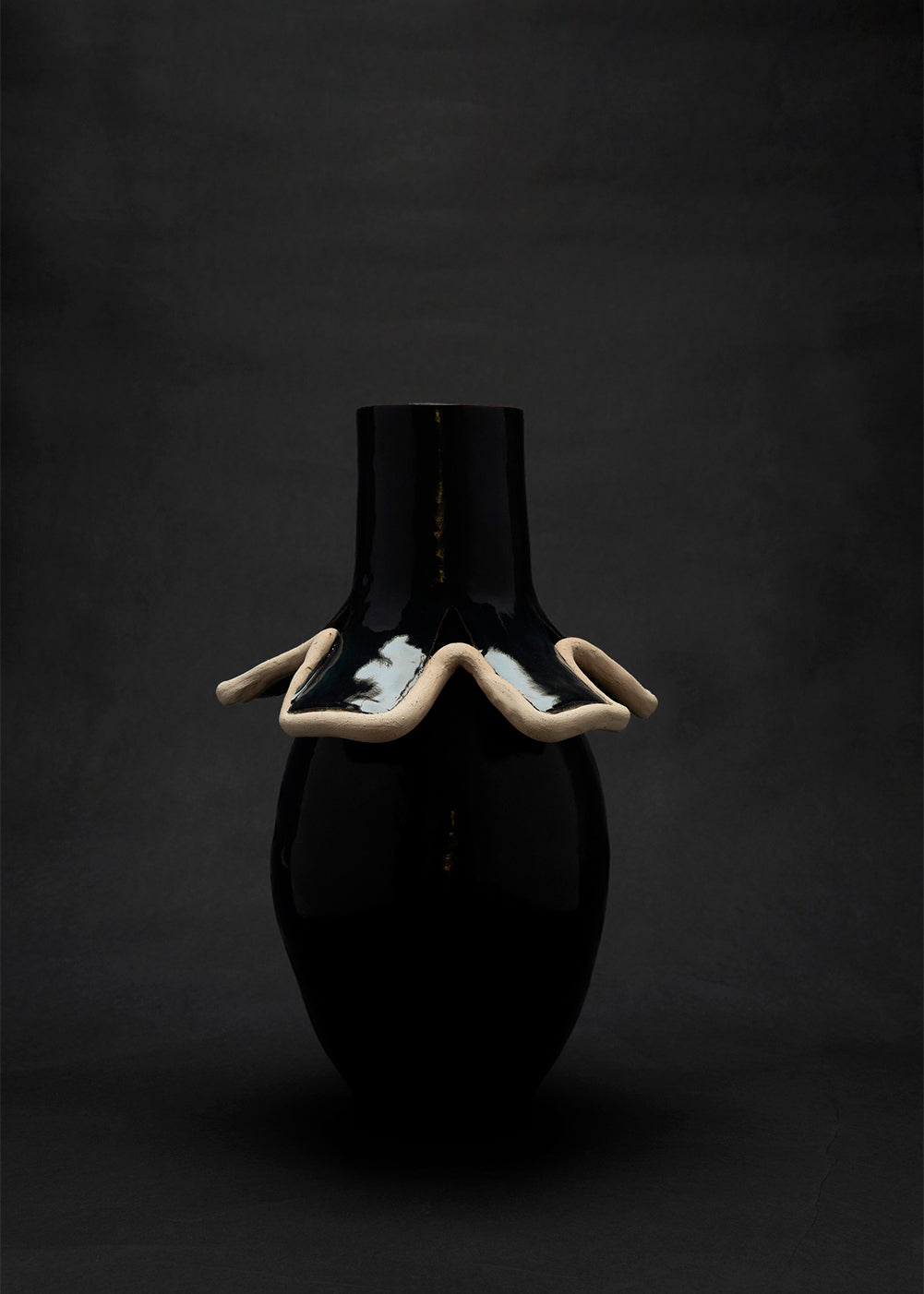 Navy blue ceramic vase with undulating raw clay collar detail