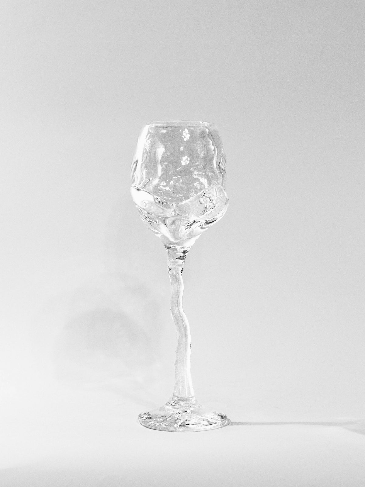 Hand-blown Wine Glass — close-up of textured clear glass surface