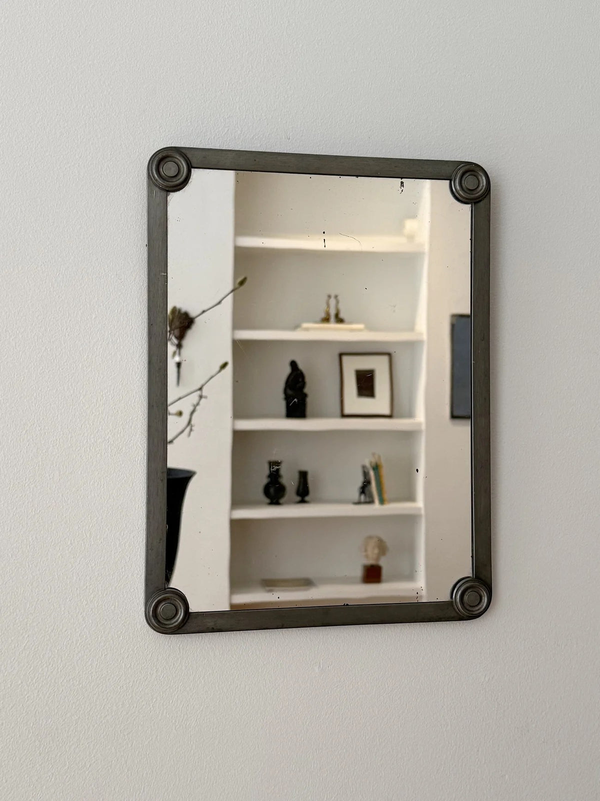 Pewter Mirror, FAK Svenskt Tenn — mounted on wall in modern interior