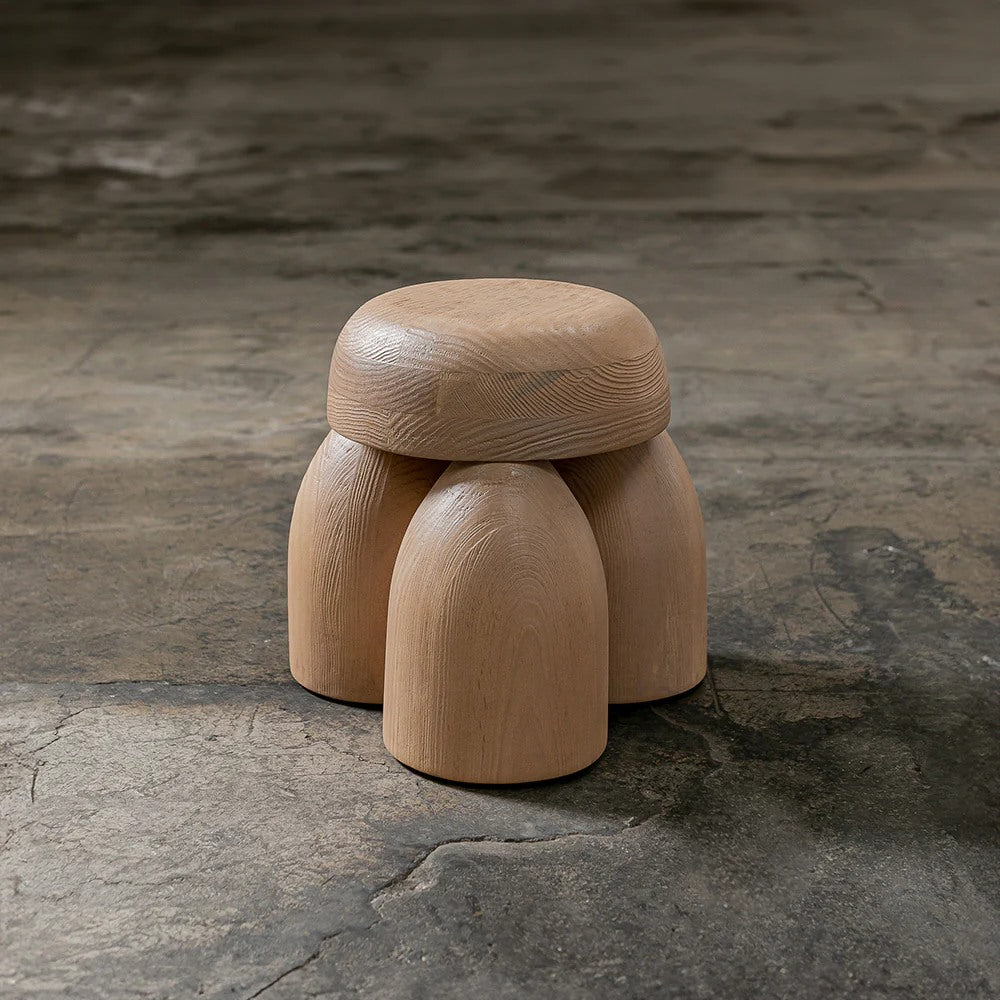 ELEMENTOS Set of Stools, sandblasted pine with black finish by Daniel Couttolenc — close-up of textured wooden surface