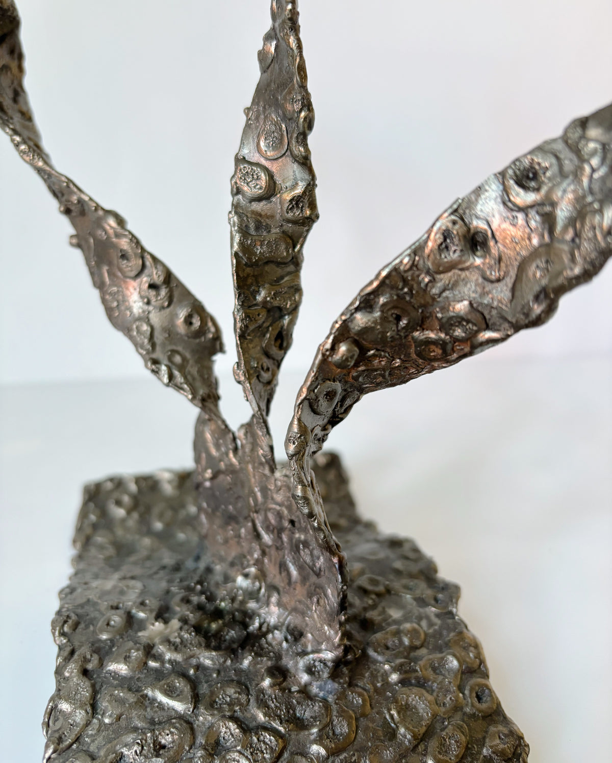 Molten Metal Sculptural 3 Arm Candlestick, Brutalist Poland — close-up of textured metal surface