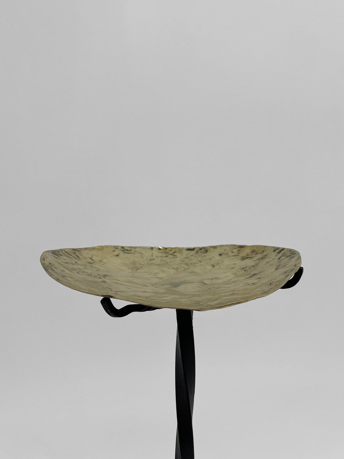 Minimalist ceramic bowl with wooden stand detail view