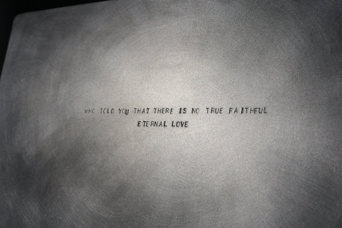 MASTER & MARGARITA — close-up of engraved metal surface