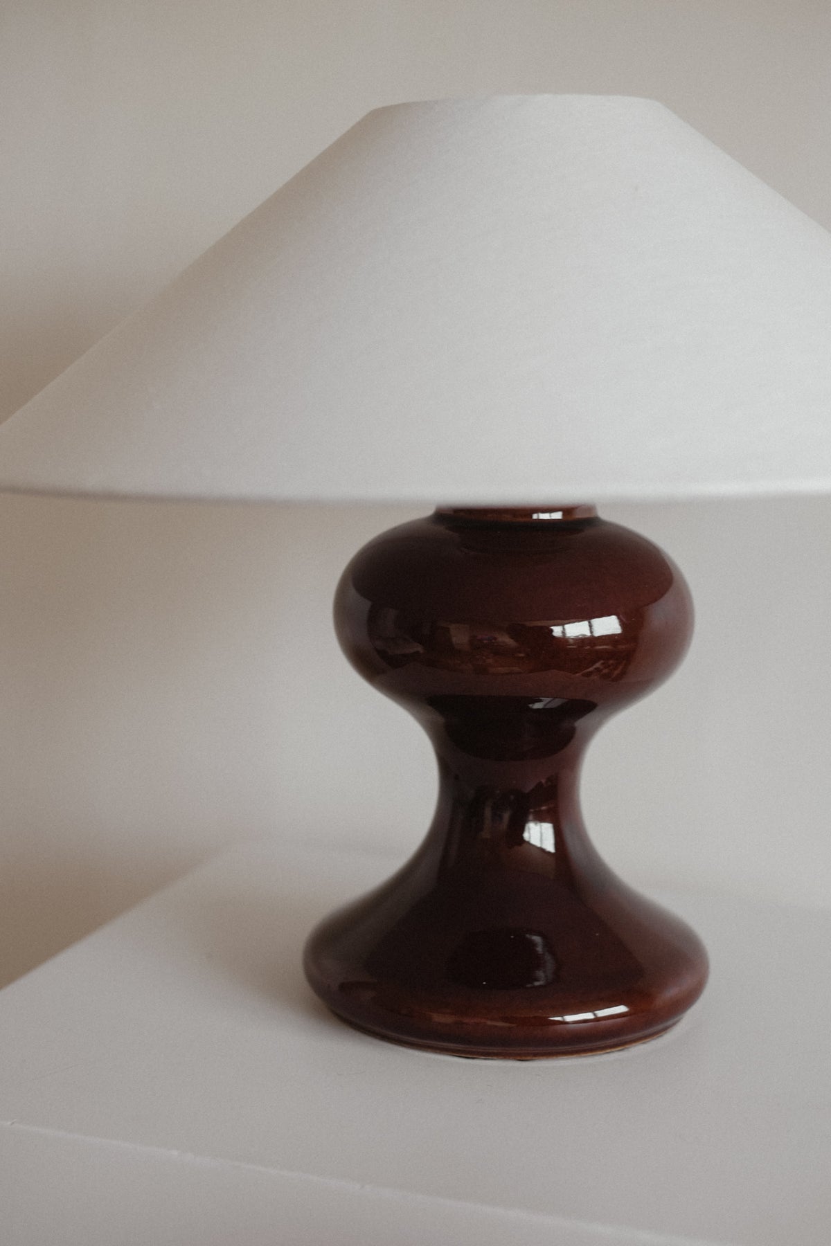 The Cordovan Hourglass Ceramic Table Lamp — in context