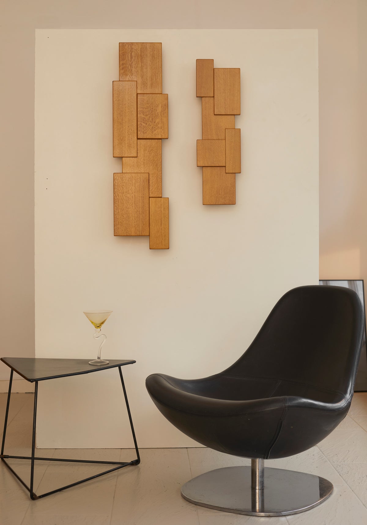 Vintage Set of Two French Oak Wood Sculptural Lamps Wall Lights C. 1980 — displayed above black chair in modern setting
