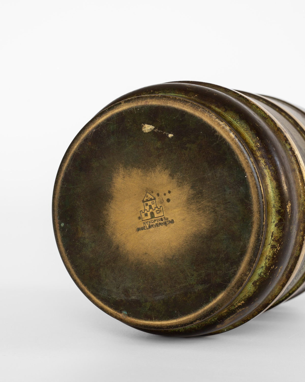 Modernist bronze vase base showing maker's mark and patina detail
