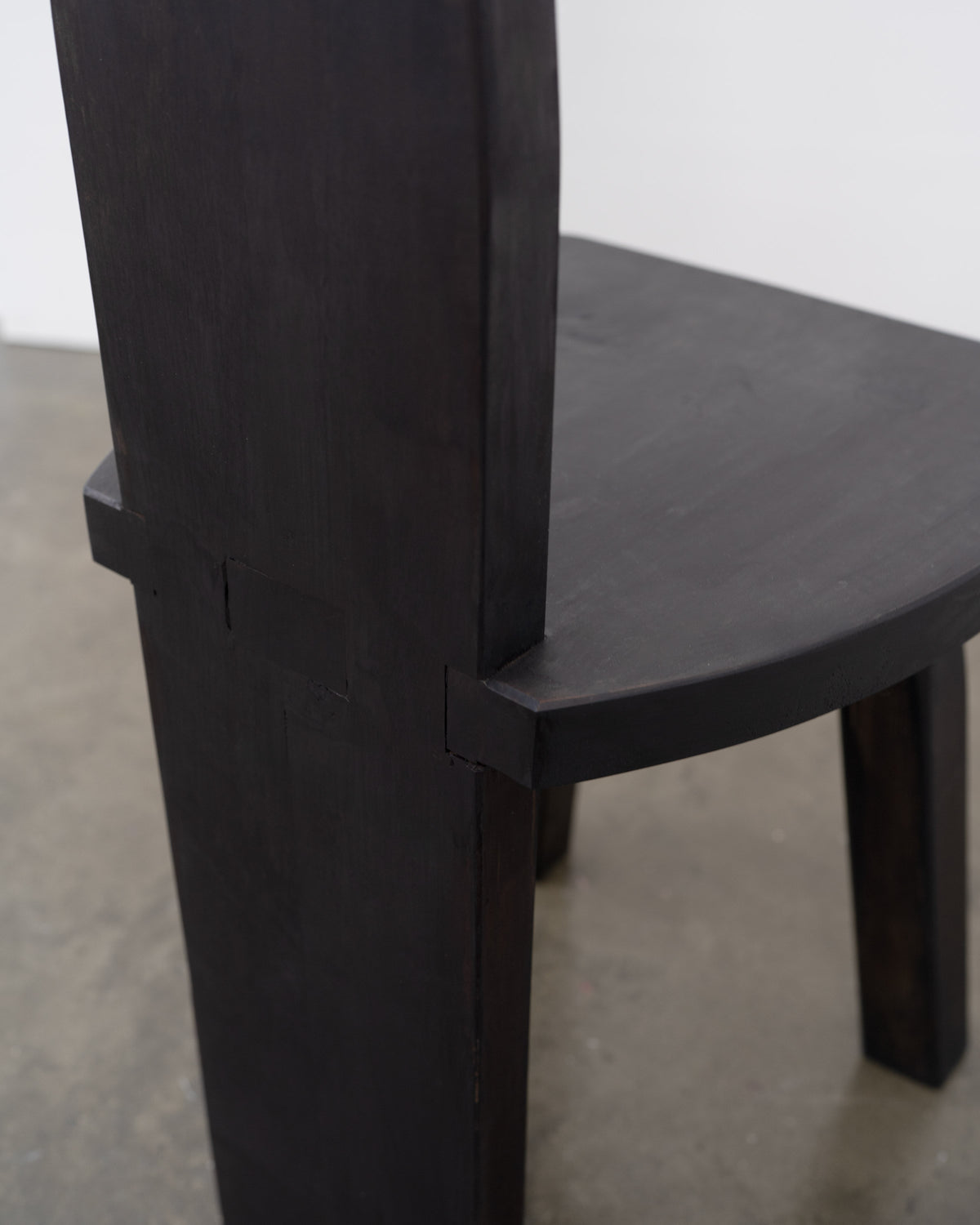 Brutalist High Back Chair — back view showing dark wood finish