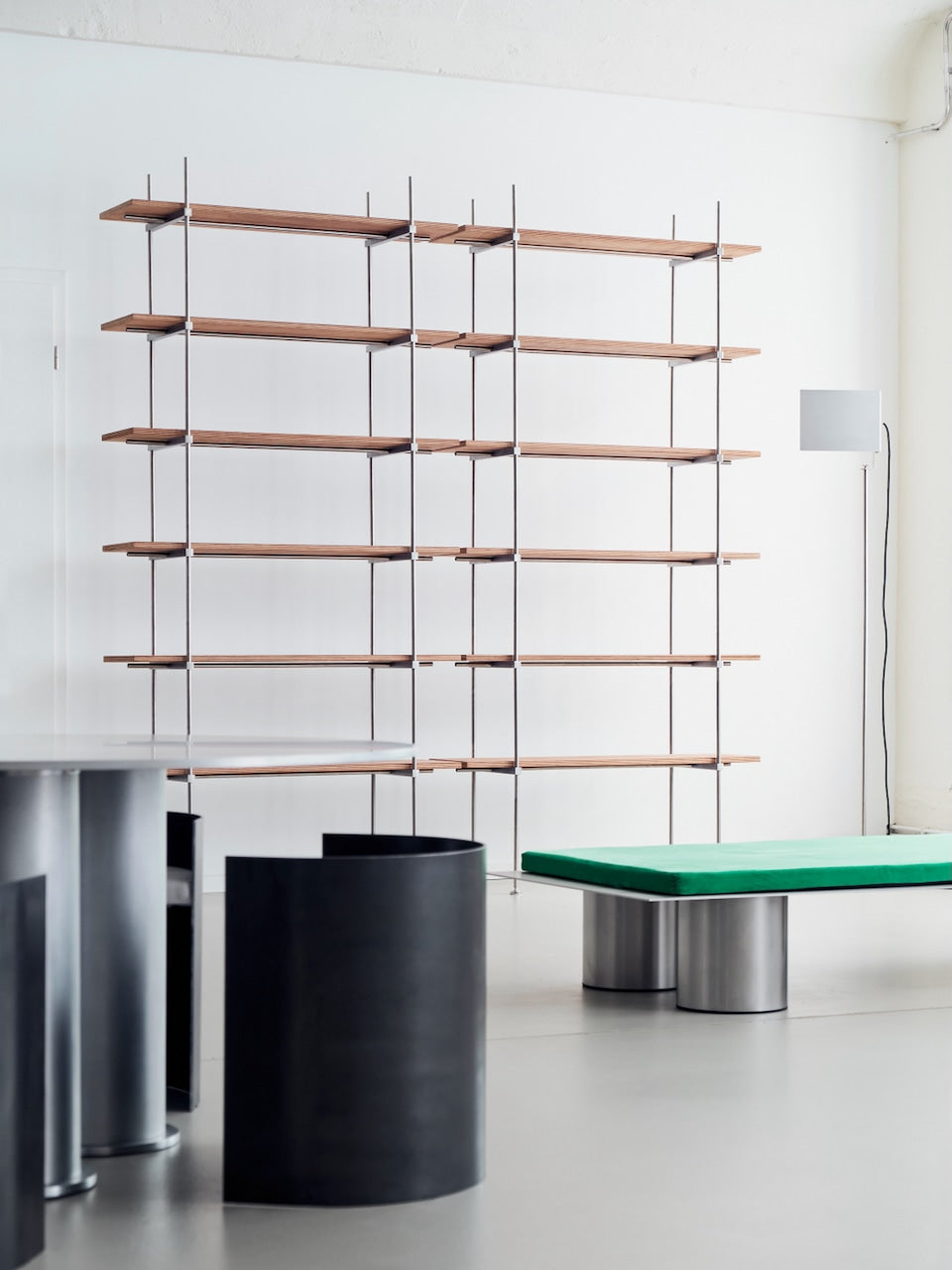 Spaghetti Shelf System — angled view in modern interior with wood shelves