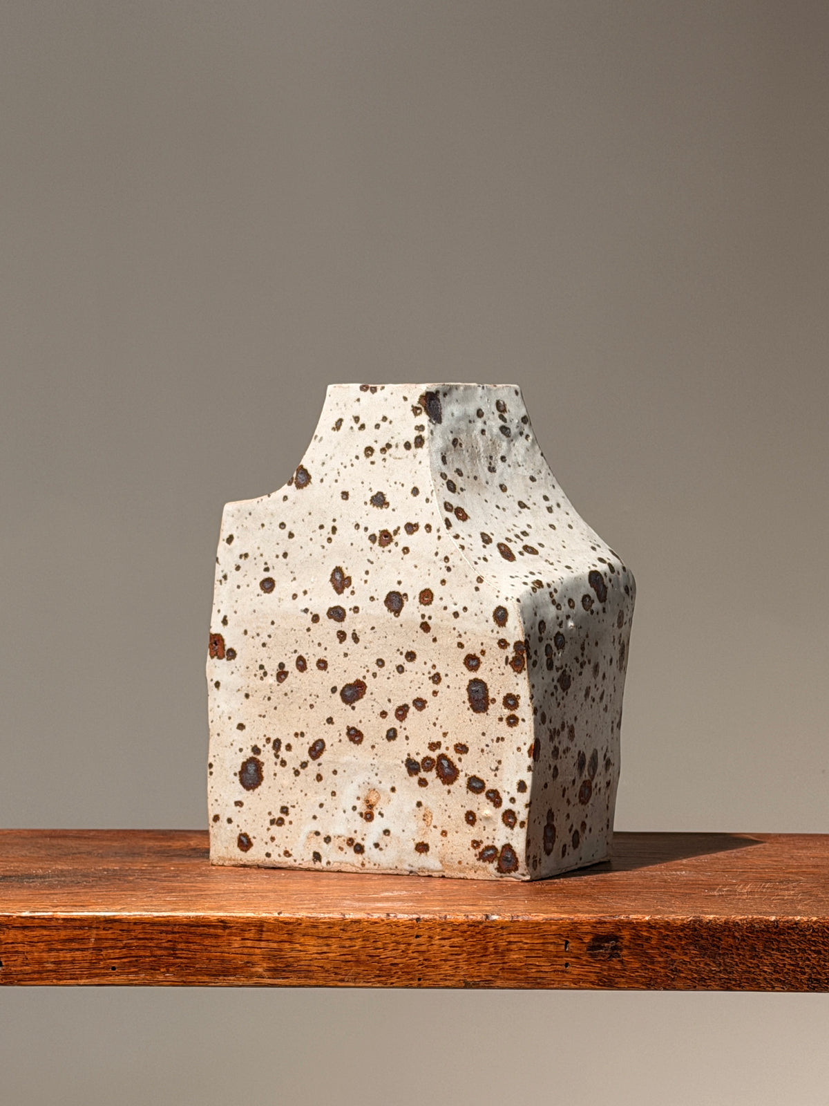 Geometric stoneware vase with pyrite glaze, France, circa 1960. — lifestyle setting