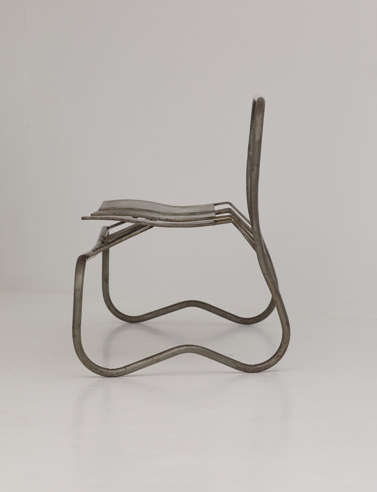 Unique Signed Artist Bench / Settee in Metal — side view showing metal frame design