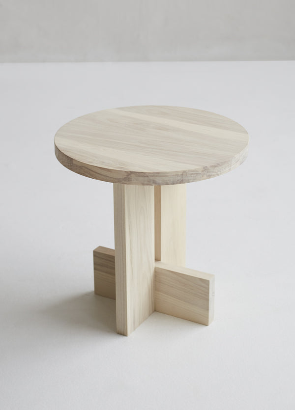 Axel Side Table in Solid Wood — angled view on light floor