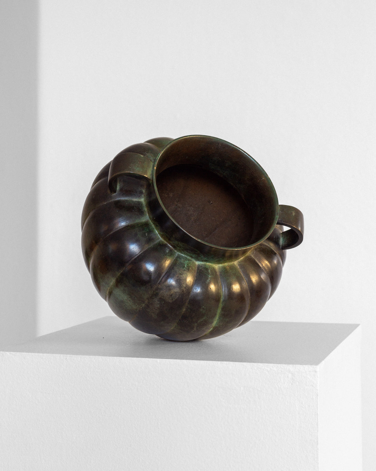 Swedish Art Deco Bronze Vase by GAB, 1930s — back view on white pedestal