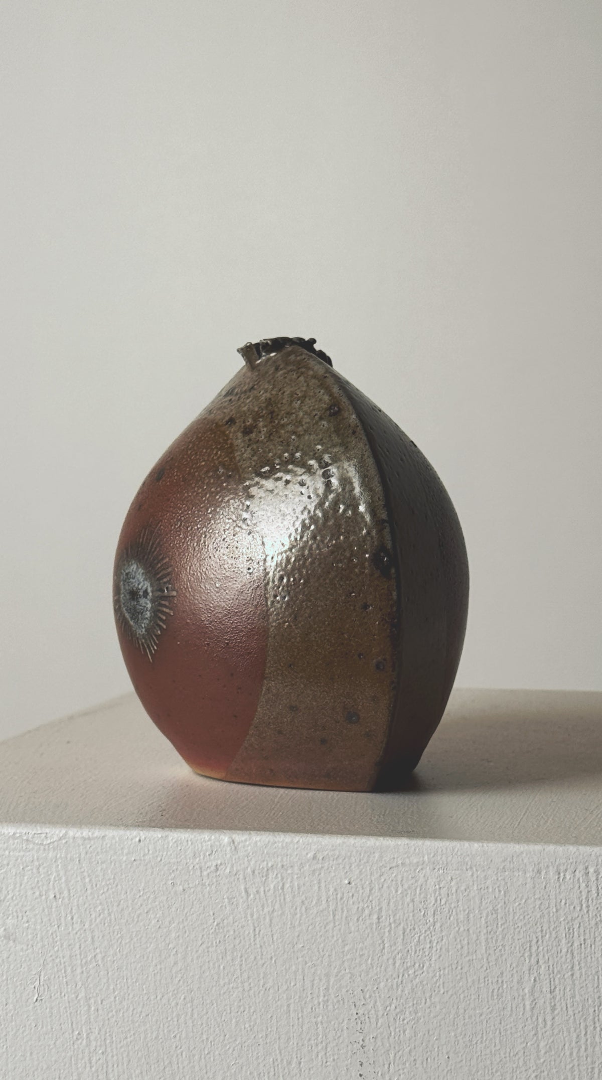 Stoneware soliflore vase showing textured glazed surface detail