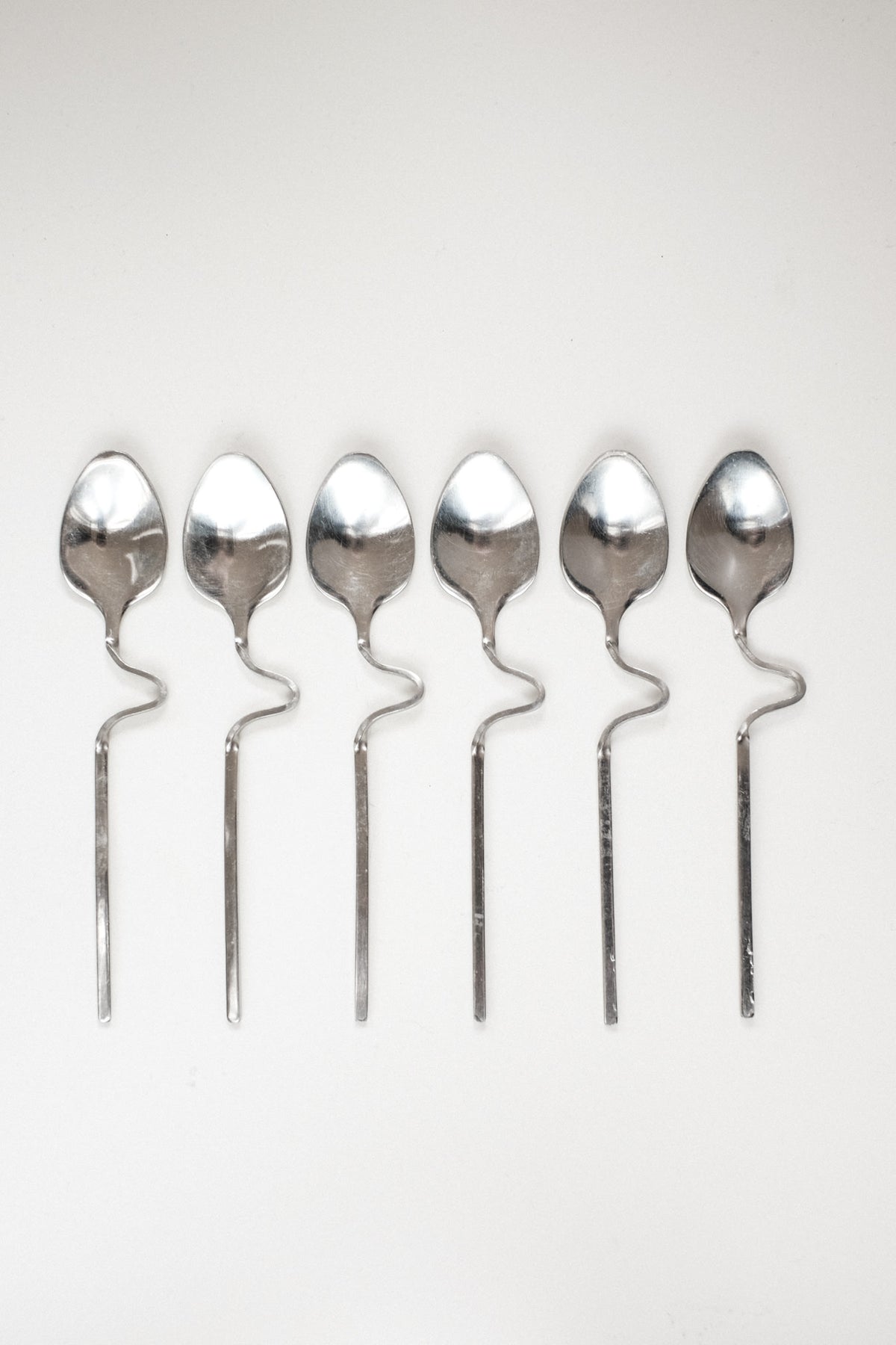Zigzag Cutlery Set — close-up of stainless steel spoons with wavy handles