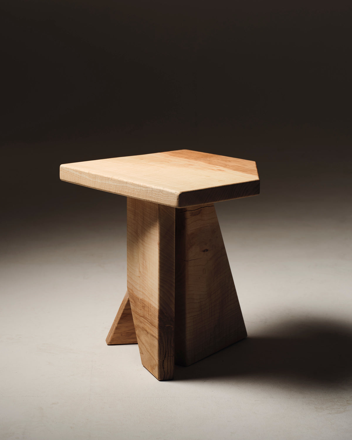 Handcrafted maple stool with geometric base by Studio Gypsandconcrete
