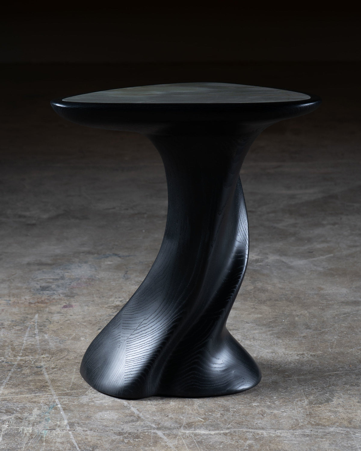 Abbi Side Table in Ebony Stain on Ash wood with Marble Top — angled view highlighting curved wooden base