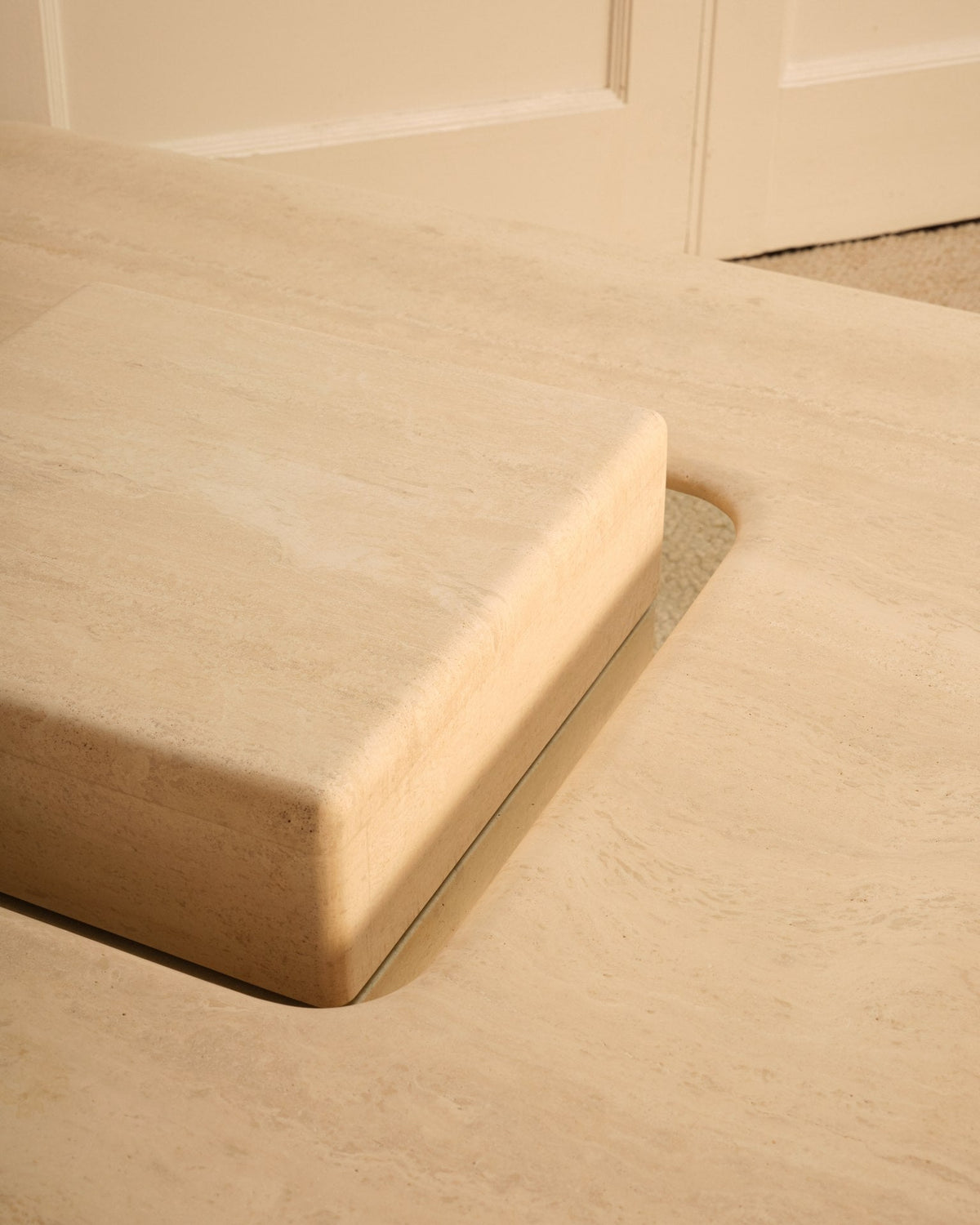 Saturn Travertine Coffee Table — close-up