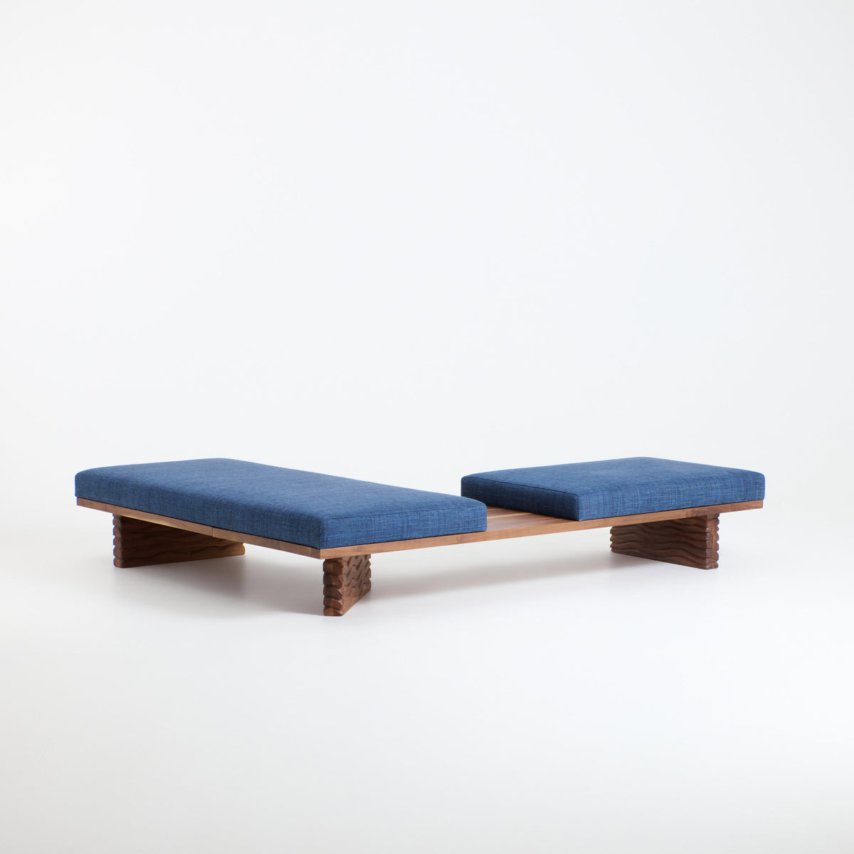 Nazaré Daybed L Shape — angled view of blue fabric cushions on wood base