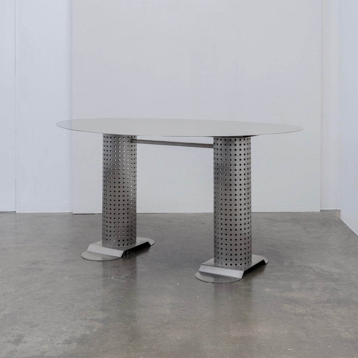 Postmodern Stainless Steel Dining Table, c.1980 — side angle showing perforated metal base