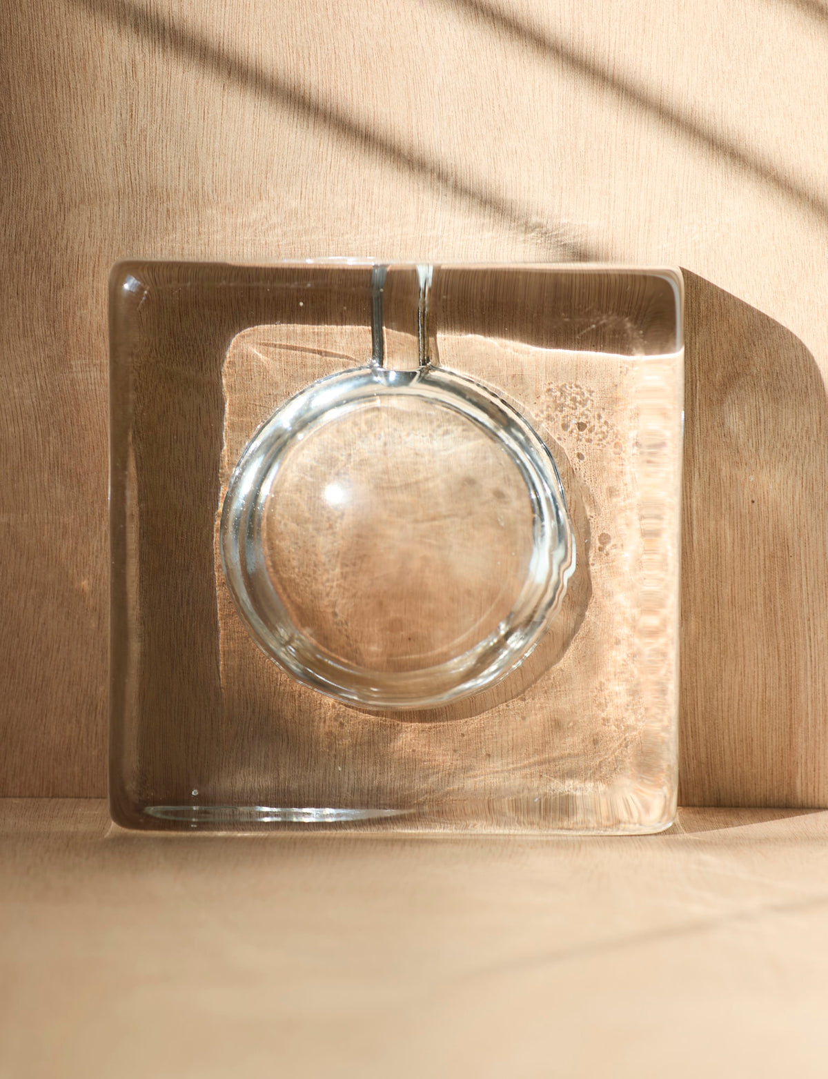 Vintage big and heavy mold-pressed glass ashtray c. 1970. — side angle