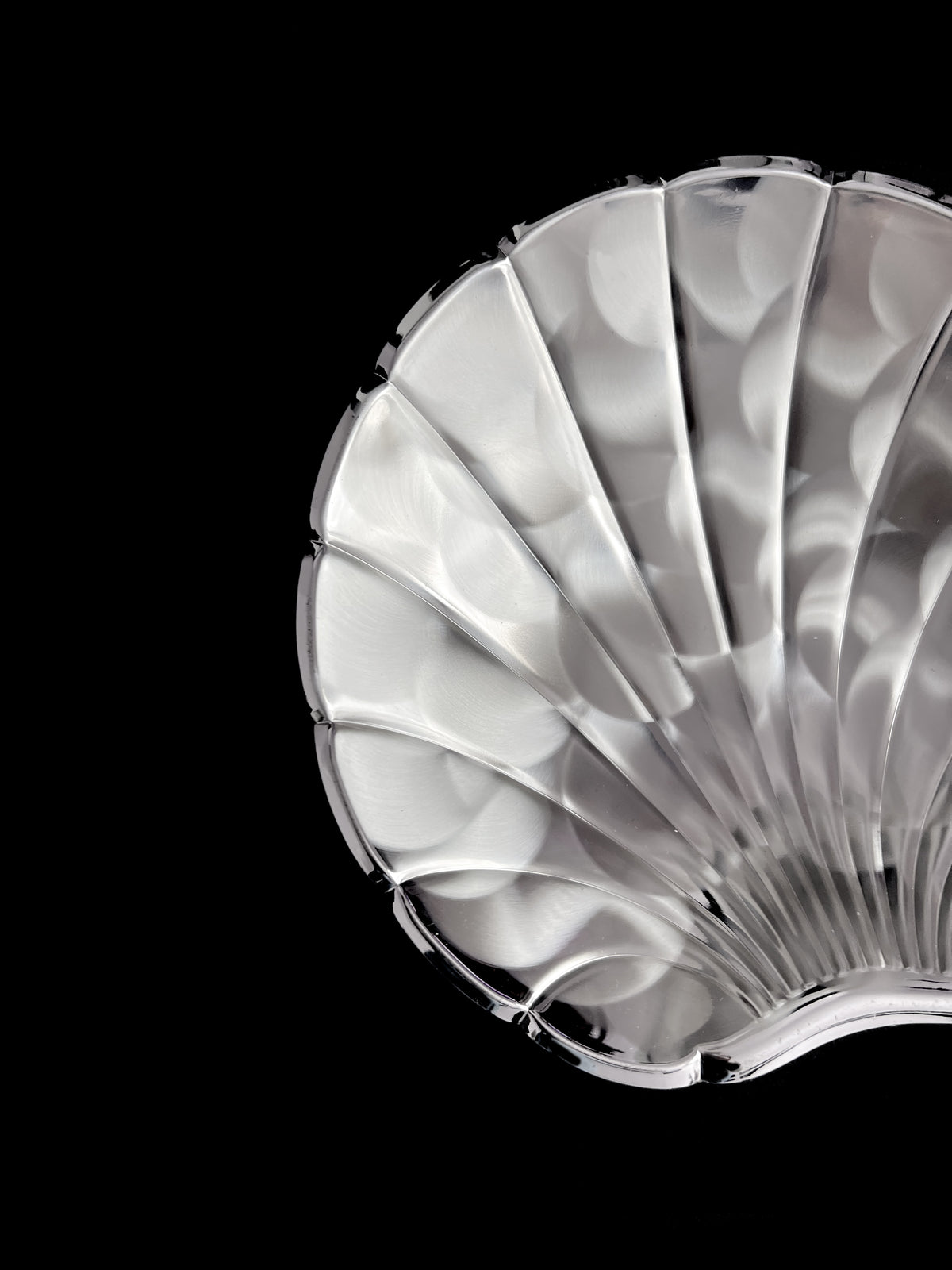 Vintage silver-plated shell dish detail showing scalloped ridges