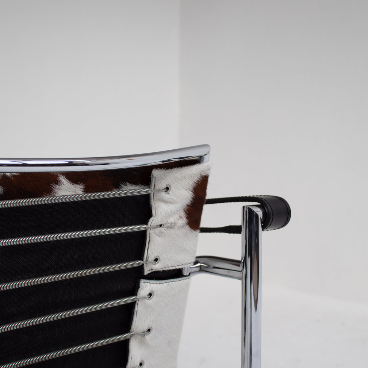 Le Corbusier, Pierre Jeanneret, Charlotte Perriand LC1 Chairs by Cassina — side angle showing chrome frame and cowhide detail