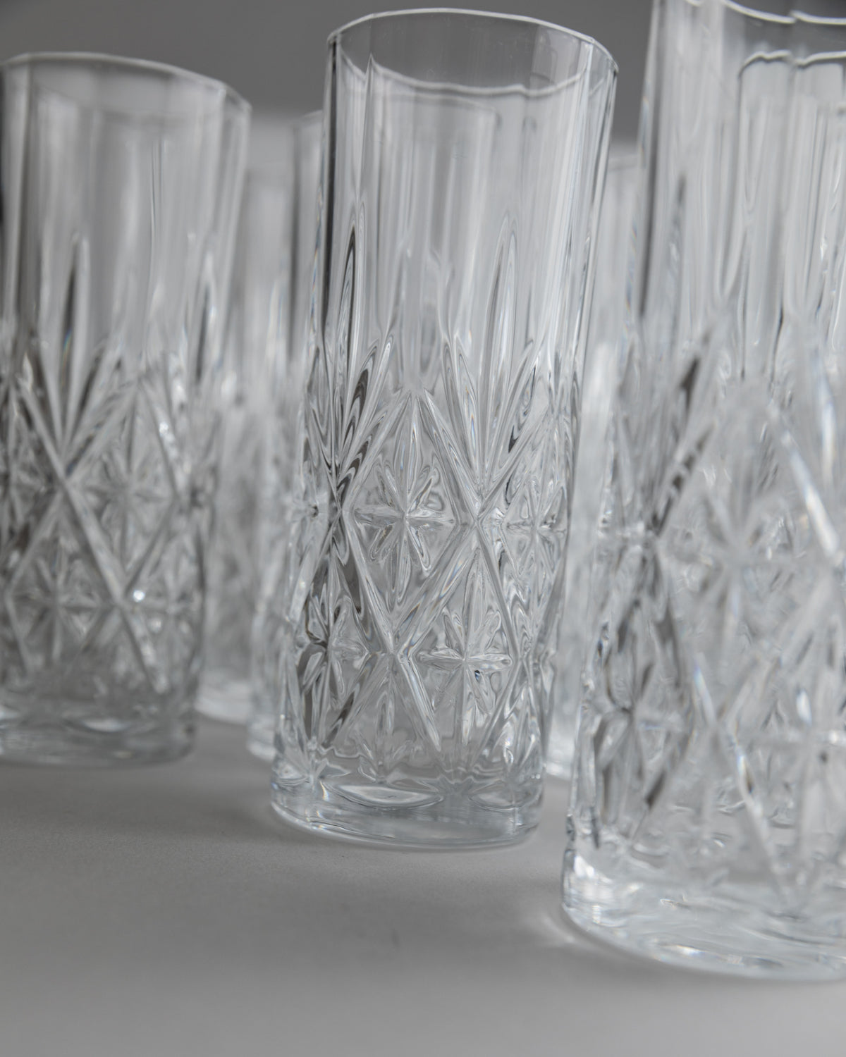 Close-up detail of cut crystal glasses with diamond pattern design