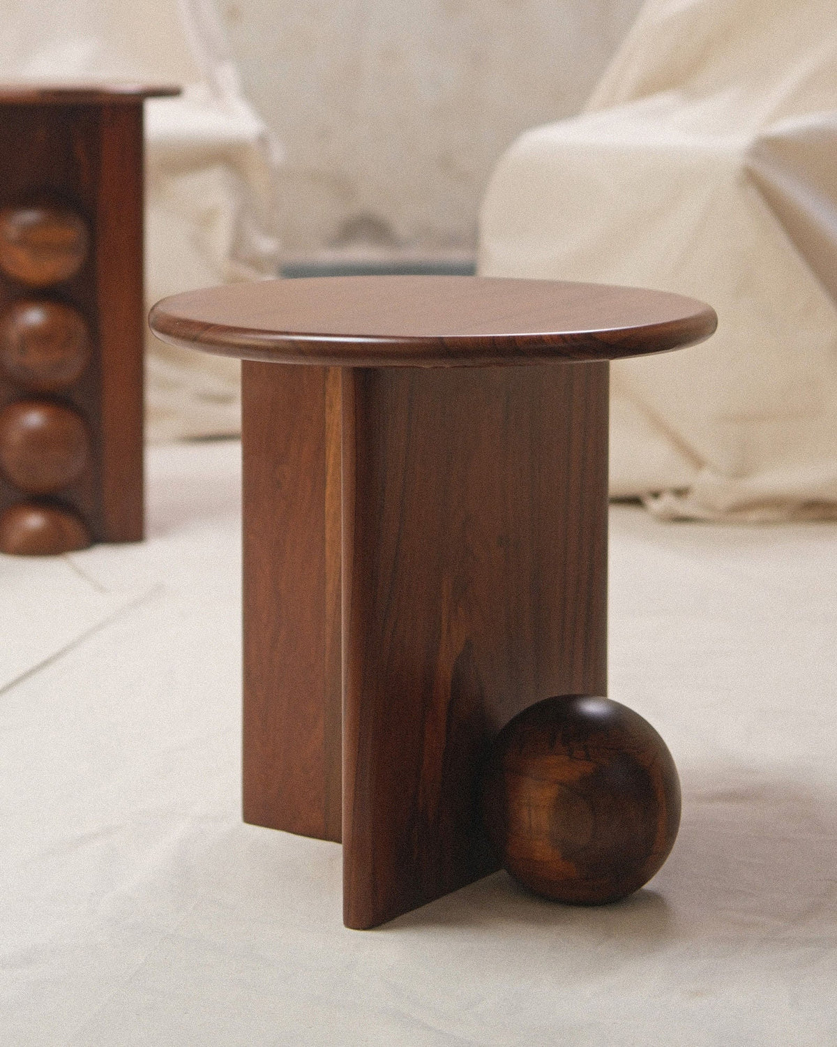 Dory walnut side table with spherical base detail by Studio Indigene