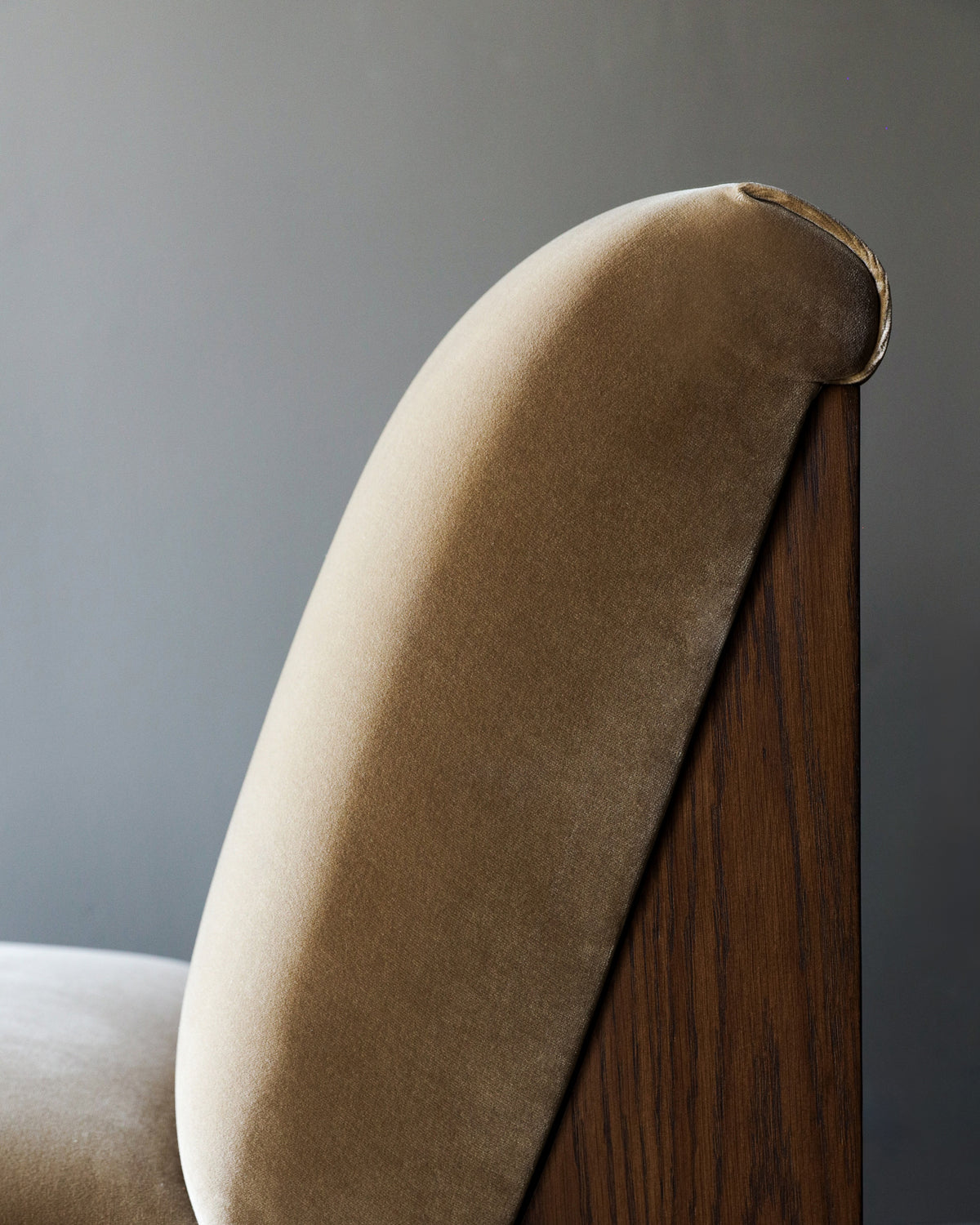 Close-up detail of Doheny lounge chair's curved upholstered backrest