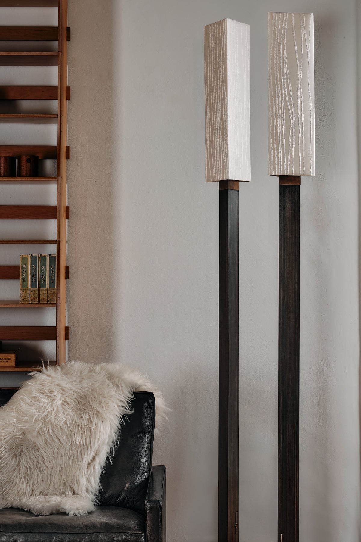 Modern Aldebaran floor lamps with textured white shades in living room
