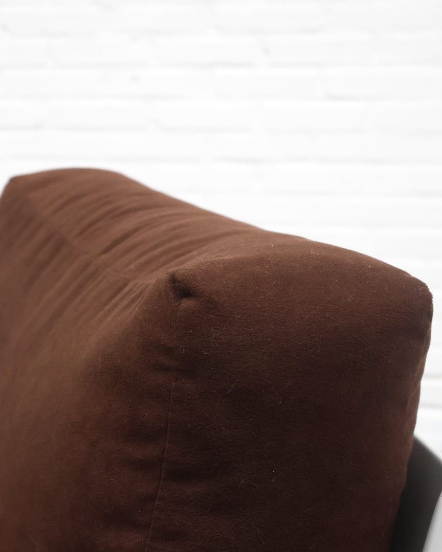 Brown leather upholstery detail of Dieter Rams 620 armchair