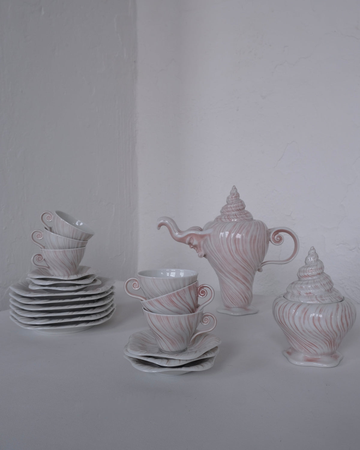 Porcelain Coffee Set "Rose Triton" by Arje Griegst for Royal Copenhagen, 1970s — side angle with pink swirls on white porcela