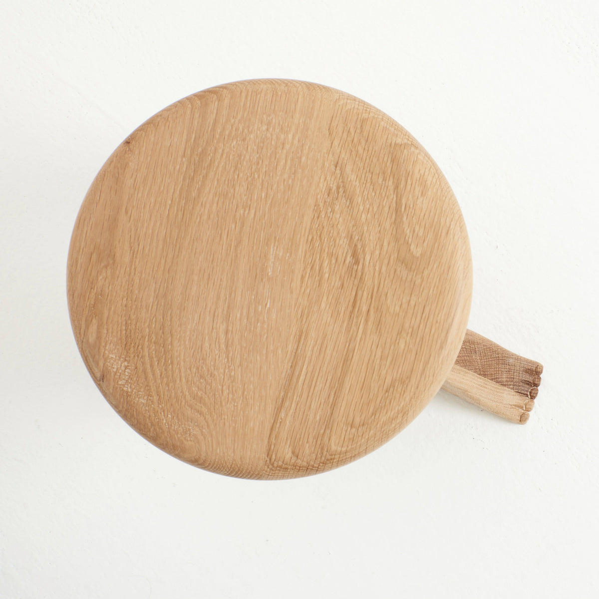 Foot Stool in Oak — top view of round oak seat