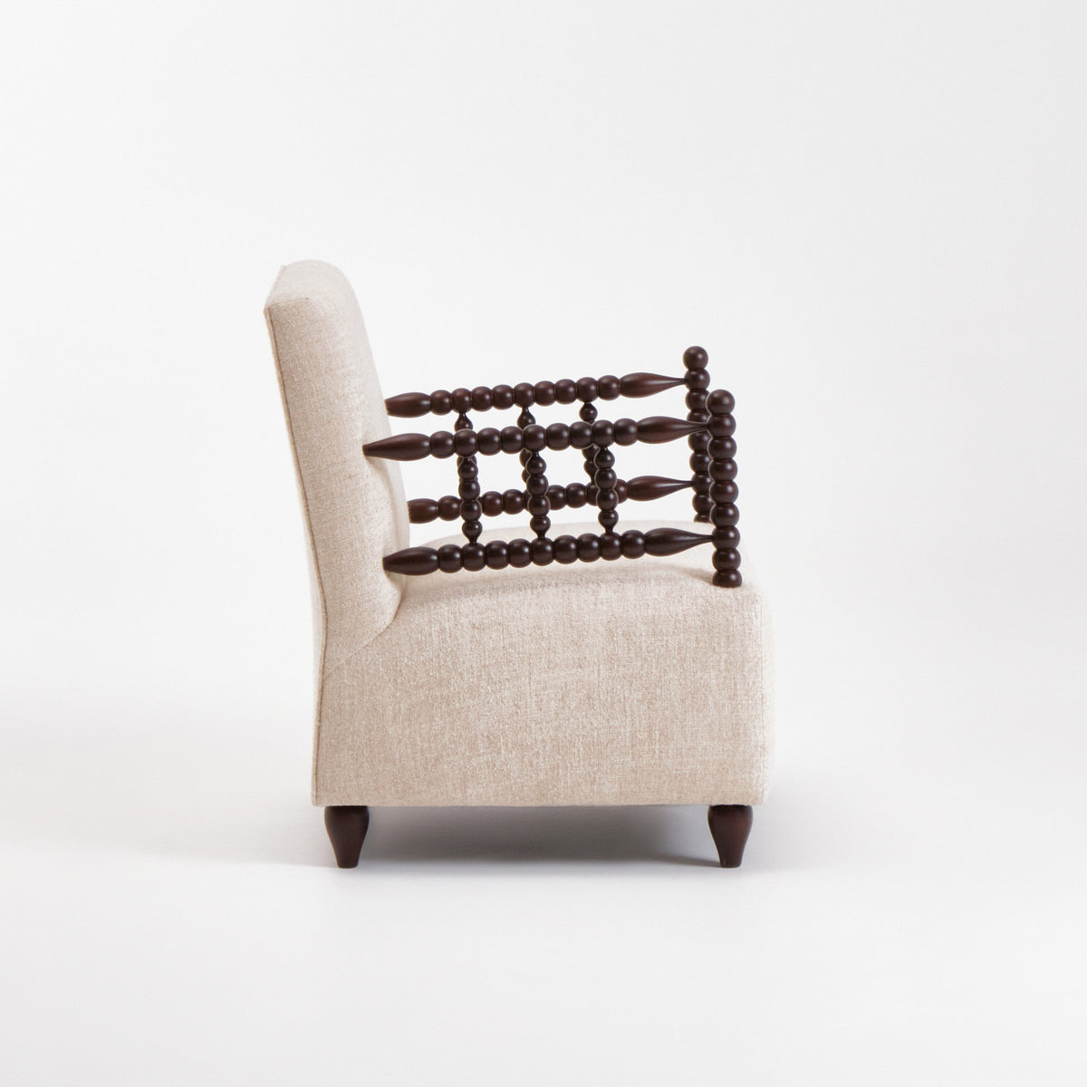 Bolha Lounge Chair — side profile showing fabric upholstery and wooden armrests