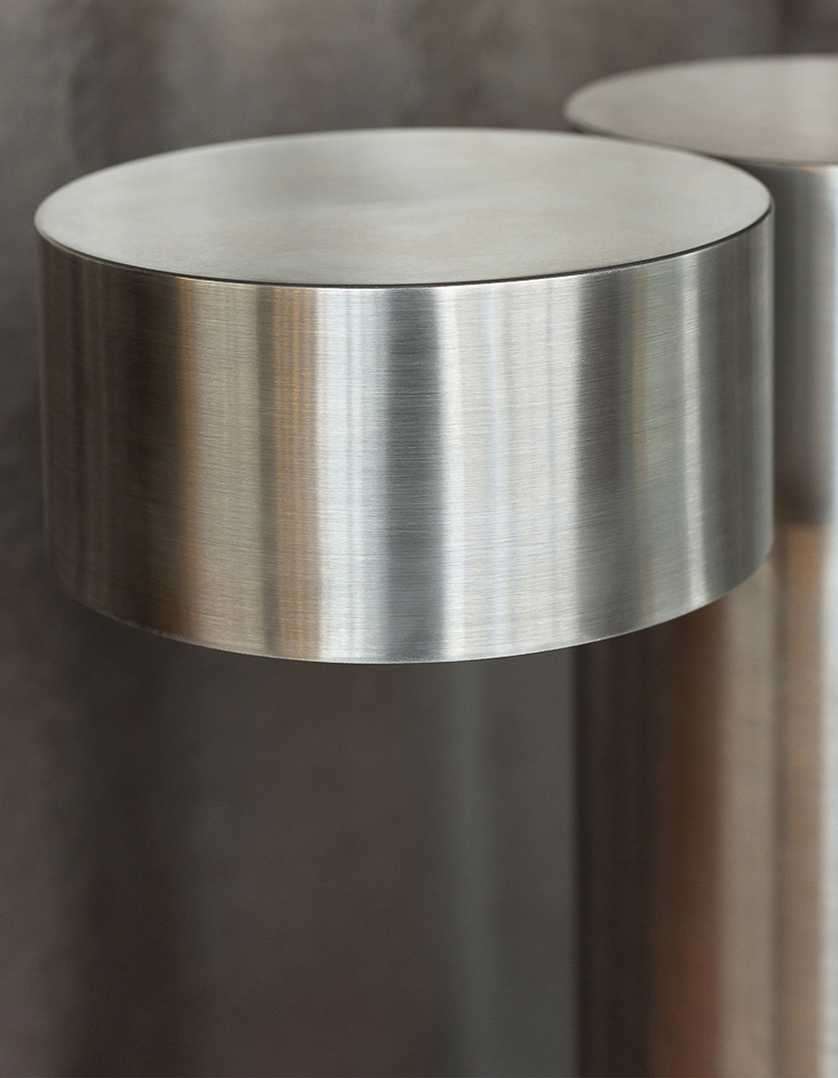 X floor lamp — close-up of brushed metal shade