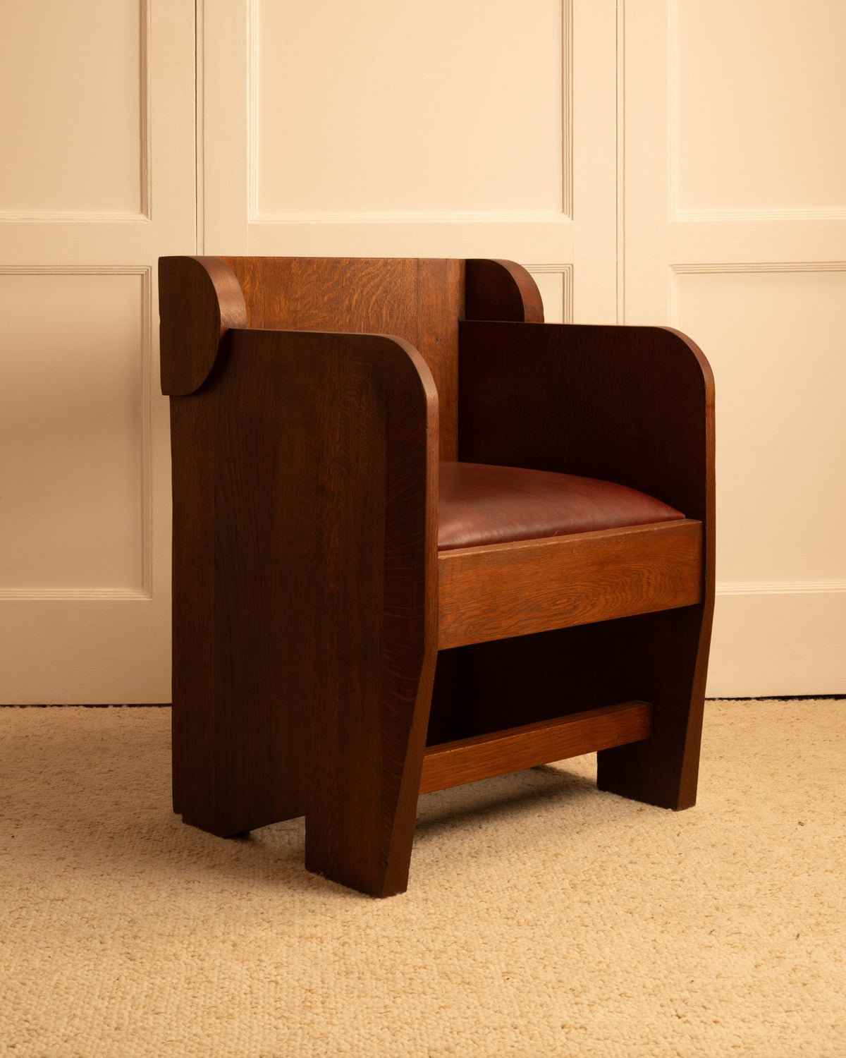 Anthroposophical walnut armchair with curved geometric forms and leather seat