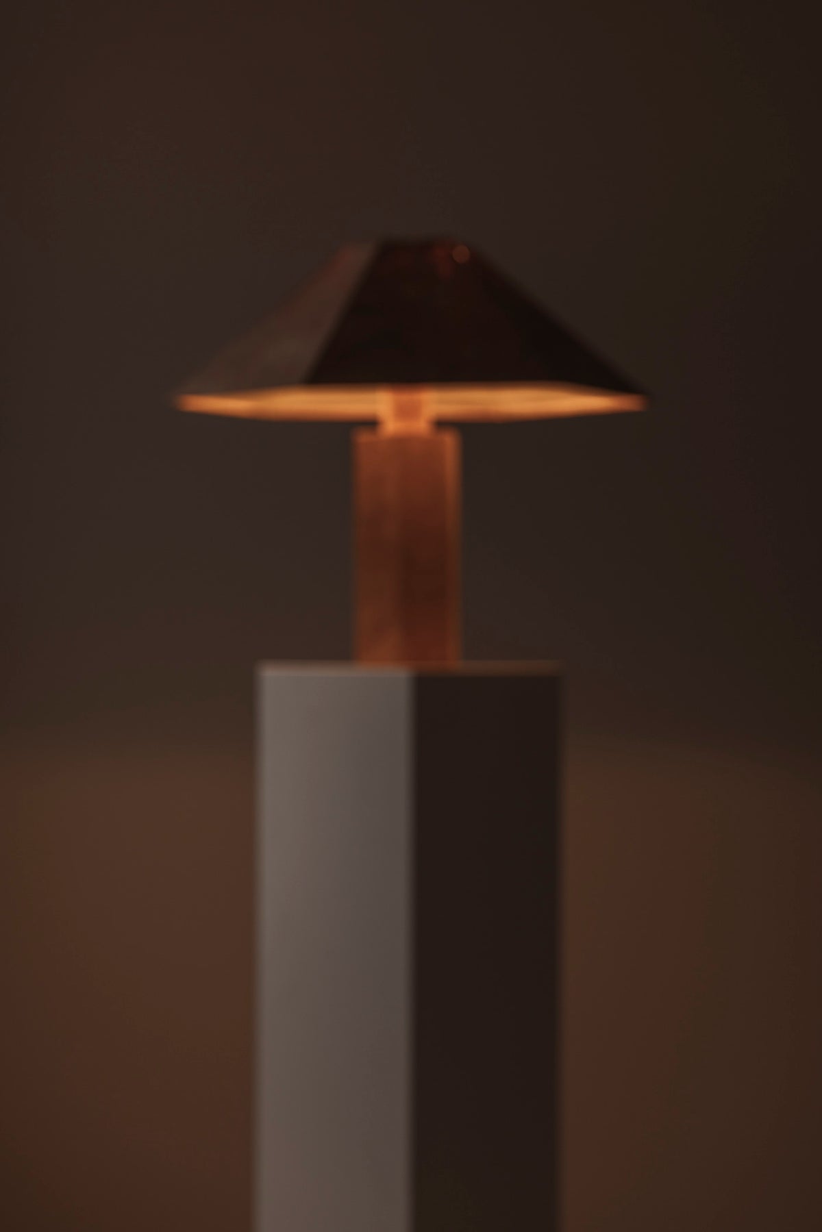 Hexagonal Cork Table Lamp by Ingo Maurer for M Design, Germany 1970s — illuminated view against dark background