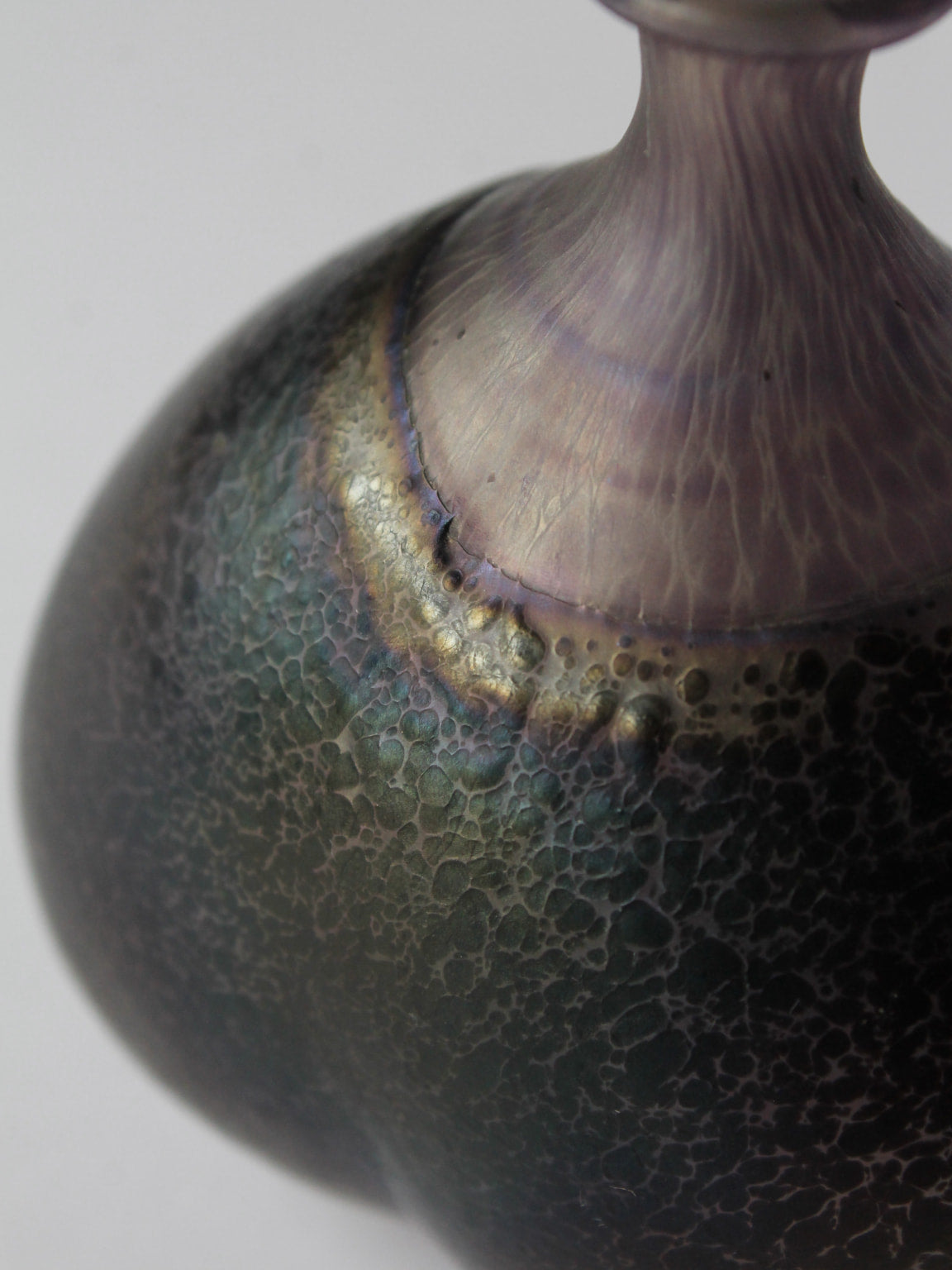 Close-up detail of Bertil Vallien Volcano art glass vase texture